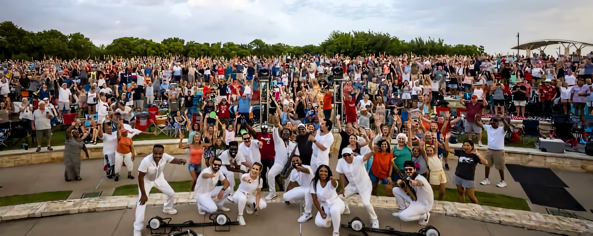 People at a concert with band