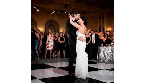 Bride and groom dancing together at their wedding reception.
