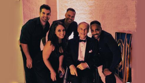 Members of Emerald City Band with some guy