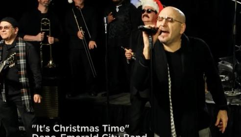 Deno and Emerald City Band singing in a studio