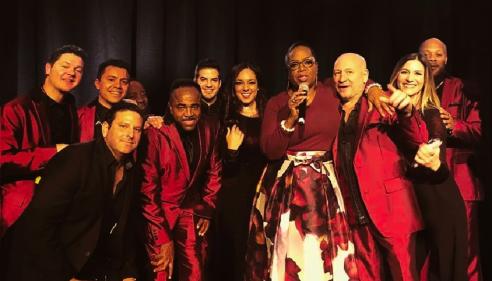 members of Emerald City Band with Oprah Winfrey