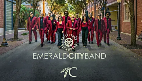 Band members in red walking down the street