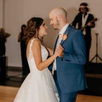 Bride and groom dancing together at their wedding reception.