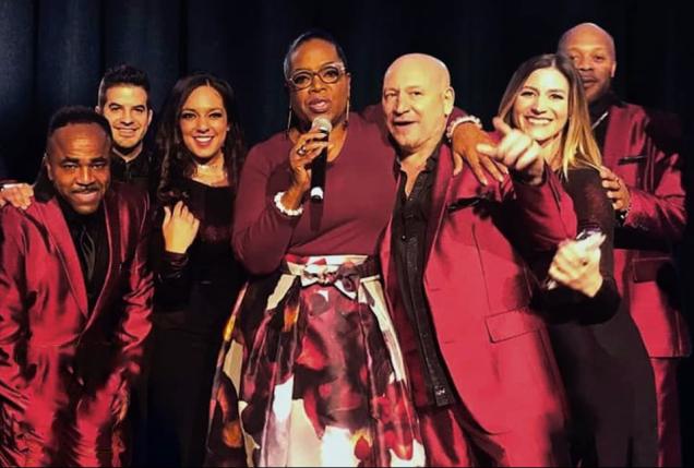Members of Emerald City Band with Oprah Winfrey