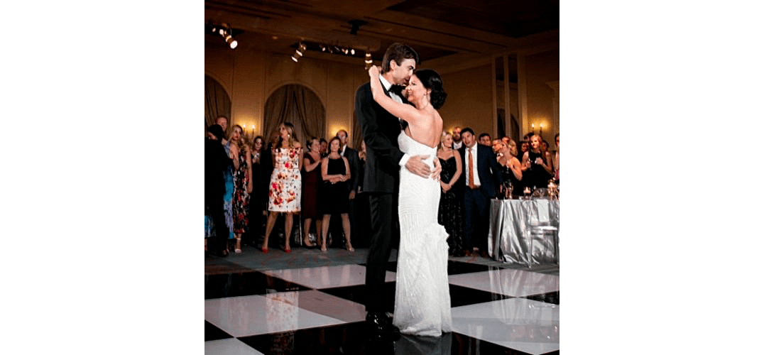 Bride and groom dancing together at their wedding reception.
