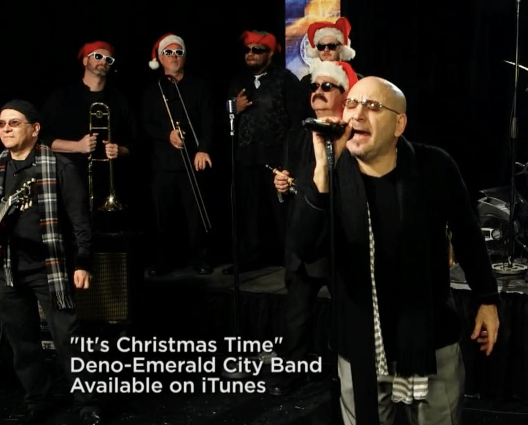 Deno and Emerald City Band singing in a studio