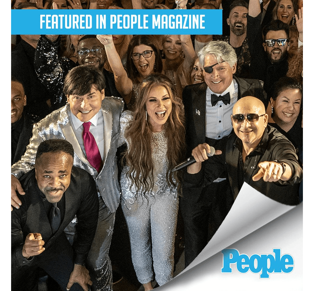 Group of people dressed formally, smiling and celebrating at an event, People logo in corner.